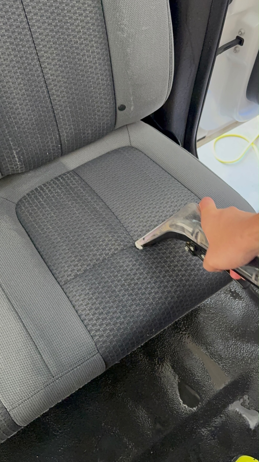 GraceWell technician deep-cleaning upholstery with a steam wand